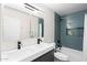 Modern bathroom with double vanity, quartz countertop, and stylish blue tile shower at 35360 N 93Rd Way, Scottsdale, AZ 85262