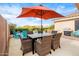 Inviting patio with outdoor dining area, vibrant blue seating, and a sparkling pool under the desert sky at 35360 N 93Rd Way, Scottsdale, AZ 85262