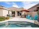 Backyard with outdoor grill, patio furniture, and lounge chairs near a private pool at 35360 N 93Rd Way, Scottsdale, AZ 85262