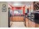 Bright kitchen with stainless steel appliances, wood cabinets, tile floors, and granite countertops at 3924 E Cortez St, Phoenix, AZ 85028