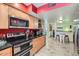 Open-concept kitchen featuring stainless appliances, a wine rack, and breakfast bar at 3924 E Cortez St, Phoenix, AZ 85028