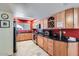 Well-lit kitchen featuring stainless appliances, wood cabinets, and a wine rack for added convenience at 3924 E Cortez St, Phoenix, AZ 85028