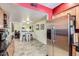 Bright kitchen flowing into the breakfast nook, with stainless appliances, and bar seating at 3924 E Cortez St, Phoenix, AZ 85028