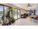 Bright and open living area with tile floors, large windows, and a ceiling fan at 3924 E Cortez St, Phoenix, AZ 85028
