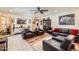 Open living space with tile flooring, leather furniture, and large windows for natural light at 3924 E Cortez St, Phoenix, AZ 85028