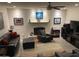 Cozy living room featuring a brick fireplace, neutral walls, and comfortable seating at 3924 E Cortez St, Phoenix, AZ 85028