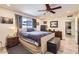 Comfortable main bedroom with a window view, upholstered furniture, and personal decor at 3924 E Cortez St, Phoenix, AZ 85028