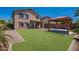 Expansive backyard featuring a lawn, patio, and pergola, perfect for outdoor enjoyment and entertaining at 41251 W Barcelona Dr, Maricopa, AZ 85138