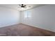 Bedroom featuring carpet flooring and ceiling fan at 41251 W Barcelona Dr, Maricopa, AZ 85138