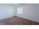 Carpeted bedroom featuring a closet door and a window providing natural light at 41251 W Barcelona Dr, Maricopa, AZ 85138