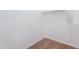 Empty walk-in closet with carpet flooring and built-in shelving at 41251 W Barcelona Dr, Maricopa, AZ 85138