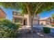 Home exterior with a two-car garage, neutral color scheme and an easy to care for front yard at 41251 W Barcelona Dr, Maricopa, AZ 85138