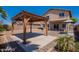 Backyard gazebo with a swing is a charming addition to this beautiful outdoor space at 41251 W Barcelona Dr, Maricopa, AZ 85138