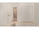 Spacious bedroom with a view to closets and a hallway at 4143 E Sundance Ave, Gilbert, AZ 85297