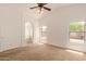 Carpeted main bedroom featuring three windows and an ensuite bathroom at 4143 E Sundance Ave, Gilbert, AZ 85297