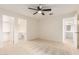 View of bedroom with ceiling fan, and open doors to bathroom and walk-in closet at 420 W Yukon Dr # 8, Phoenix, AZ 85027