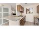Practical kitchen layout featuring a breakfast bar, stainless steel sink, and essential appliances for convenient meal preparation at 420 W Yukon Dr # 8, Phoenix, AZ 85027
