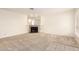 Spacious living room featuring a mirrored wall accent and neutral carpet, creating an open and airy feel at 420 W Yukon Dr # 8, Phoenix, AZ 85027