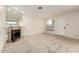 Bright living room with cozy fireplace and neutral carpet, offering a comfortable and inviting atmosphere at 420 W Yukon Dr # 8, Phoenix, AZ 85027