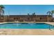 Refreshing community pool with multiple fountains, lounge chairs, and clear blue water at 420 W Yukon Dr # 8, Phoenix, AZ 85027