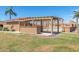 Community picnic area with covered tables, lush green lawn, and desert landscaping at 420 W Yukon Dr # 8, Phoenix, AZ 85027