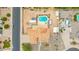 Bird's eye view of a well-maintained home showcasing landscaping, a backyard pool, and desert surroundings at 4622 E Ellis Cir, Mesa, AZ 85205