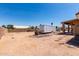 Expansive backyard featuring a trailer, hardscape and an open space, perfect for outdoor activities and RV storage at 4622 E Ellis Cir, Mesa, AZ 85205