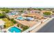 Aerial view showcasing a backyard with a pool, covered patio, and well-maintained landscaping, perfect for outdoor living at 4622 E Ellis Cir, Mesa, AZ 85205