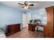 Bright bedroom with stylish furniture, natural light and a fun cloud mural at 4622 E Ellis Cir, Mesa, AZ 85205