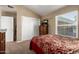 Bedroom features plush carpeting, vaulted ceiling, and traditional furnishings at 4622 E Ellis Cir, Mesa, AZ 85205