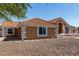 Single-Gathering home featuring desert landscaping and large windows at 4622 E Ellis Cir, Mesa, AZ 85205