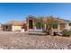 Charming stucco home with tile roof, rock landscaping, and arched entry at 4622 E Ellis Cir, Mesa, AZ 85205