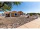 Beautiful single-story home showcasing desert landscaping and a tiled roof at 4622 E Ellis Cir, Mesa, AZ 85205
