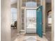 Inviting foyer with tiled floor, soaring ceilings, and bright blue entry door at 4622 E Ellis Cir, Mesa, AZ 85205