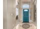 Welcoming home foyer features high ceilings, tile floors and bright entry door at 4622 E Ellis Cir, Mesa, AZ 85205