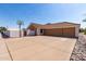 This spacious home has a convenient three-car garage and a large driveway for easy parking at 4622 E Ellis Cir, Mesa, AZ 85205