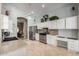 Bright kitchen features white cabinets and stainless steel appliances at 4622 E Ellis Cir, Mesa, AZ 85205