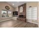 Cozy living room features a brick fireplace and vaulted ceilings at 4622 E Ellis Cir, Mesa, AZ 85205