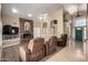 Inviting living area with brick fireplace, hardwood floors, and open floor plan at 4622 E Ellis Cir, Mesa, AZ 85205