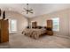 Spacious main bedroom with vaulted ceiling and ceiling fan at 4622 E Ellis Cir, Mesa, AZ 85205