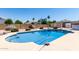 Backyard pool and landscaping under sunny blue sky at 4622 E Ellis Cir, Mesa, AZ 85205