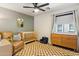 Bedroom featuring natural wood crib, olive accent wall, and tan leather chair at 4759 E Woburn Ln, Cave Creek, AZ 85331