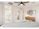 Inviting bedroom with ensuite bathroom access, closet, and a modern dresser at 4759 E Woburn Ln, Cave Creek, AZ 85331