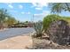 Community entrance, featuring desert landscaping, rock signage, and gated entry at 4759 E Woburn Ln, Cave Creek, AZ 85331
