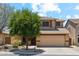 Charming two-story home with a desert landscape, tile roof, and attached two-car garage at 4759 E Woburn Ln, Cave Creek, AZ 85331