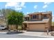 Inviting two-story home with a desert landscaped front yard, a two-car garage, and a tile roof at 4759 E Woburn Ln, Cave Creek, AZ 85331