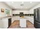 Well-lit kitchen with granite countertops, stainless steel appliances, and a functional center island at 4759 E Woburn Ln, Cave Creek, AZ 85331