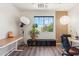 Inviting home office with natural light, modern lighting, and beautiful wood-look floors at 4759 E Woburn Ln, Cave Creek, AZ 85331