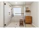Stylish glass-enclosed shower featuring a sleek bench and modern fixtures at 4759 E Woburn Ln, Cave Creek, AZ 85331