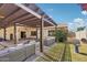 Inviting backyard with a covered patio, lounge seating, and lush greenery at 4920 E Osborn Rd, Phoenix, AZ 85018